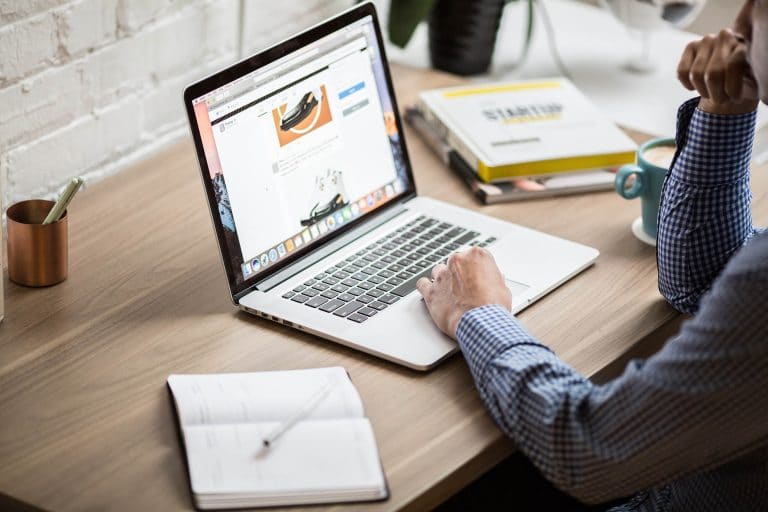 man looking at laptop computer