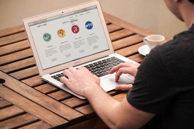 person typing on a laptop computer