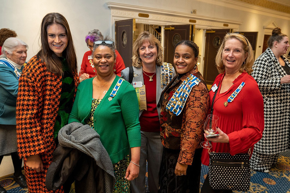 group of women at a meeting and smiling